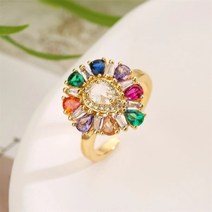 Detailed close-up of a flower cocktail ring with multi-color zircons on a gold base