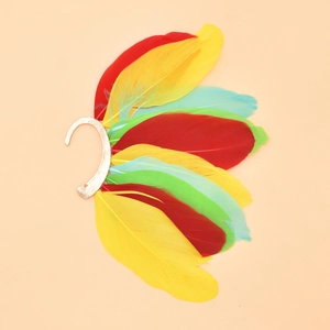 Detail of colorful bohemian peacock feathers on a vintage style metal ear hook earring