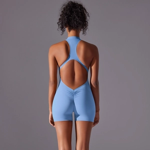 Close-up of ruched detail and cut-out racerback design on light blue yoga bodysuit