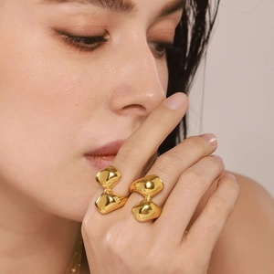Irregular geometric 18K gold-plated stainless steel rings shown on model fingers