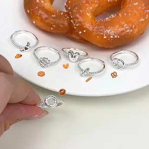 Handcrafted S925 sterling silver bread-shaped rings featuring cute croissant and waffle designs