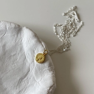 Minimalist 925 sterling silver coin pendant necklace with golden relief and silver chain