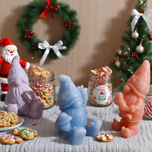 Detailed trio of colorful gnome candles with matte finish in a festive Christmas setting