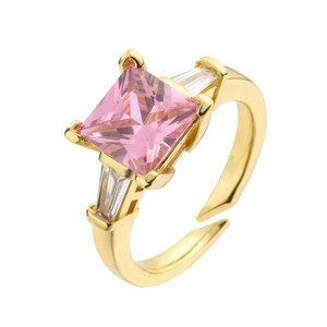 Macro detail of adjustable gold ring featuring a square pink zircon and claw setting