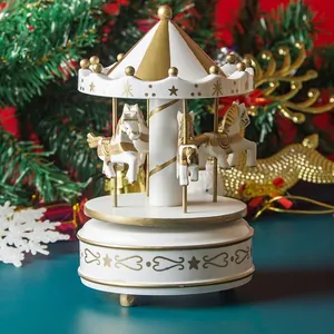 White and gold carousel music box carousel spinning with festive Christmas decorations