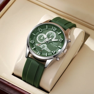 Detail of green quartz watch with textured dial and silicone strap in a luxury gift box