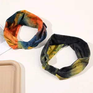 Detail of two-pack tie-dye elastic twist headbands with soft knit fabric texture