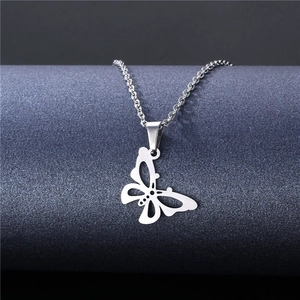 Minimalist hollow butterfly pendant necklace in polished titanium steel on display