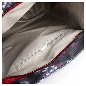 Detail of the inner lining featuring a herringbone pattern and an internal zip pocket