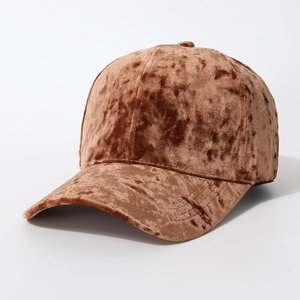 Textured brown velvet baseball cap with a classic stitched brim in a professional studio shot