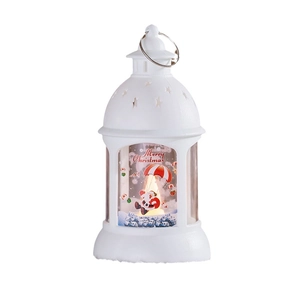 White Christmas lantern with Santa scene and star cutout lid showing warm light