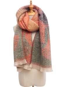Detailed texture of jacquard ginkgo leaf pattern on a soft orange and grey woven scarf