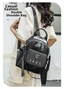 Detail view of black PU leather backpack with silver studs and rhinestone 1961 decoration