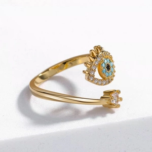 Detail of S925 engraved mark on gold adjustable evil eye ring with blue stones