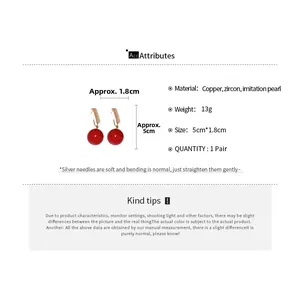Detailed view of red zircon and pearl drop earrings with product dimensions and specs