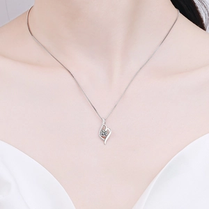 Elegant S925 sterling silver heart necklace with moissanite pendant worn by a model