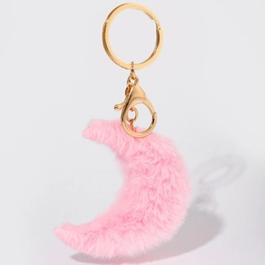 Pink plush crescent moon keychain with golden lobster clasp and key ring on white background