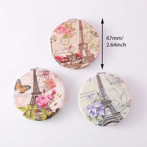 Detailed view of 67mm vintage Eiffel Tower folding pocket mirrors with dimensions