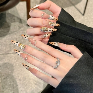 Handmade leopard print stiletto press-on nails with luxury yellow rhinestones and silver crystals