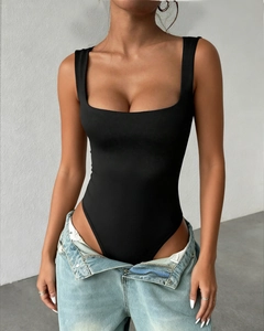 Close-up of a black square-neck bodysuit paired with denim jeans for a Y2K aesthetic
