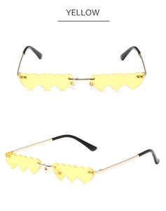 Detailed views of rimless sunglasses with yellow heart-shaped lenses and gold metal temples
