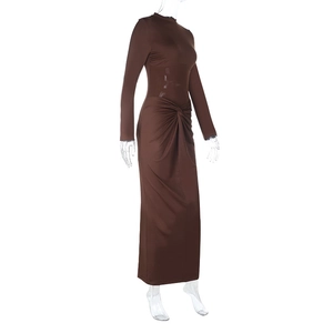 Detail view of brown bodycon dress featuring mesh waist panels and side knot pleats