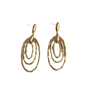 Golden minimalist three-layer oval hoop earrings with hammered metal texture for women