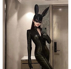 Close-up of black glossy bunny mask with shiny leather bodysuit for Halloween party costume