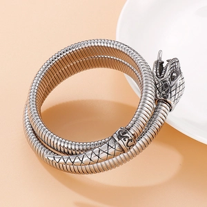 Polished stainless steel wrap-around snake bracelet with detailed scale texture and engraving