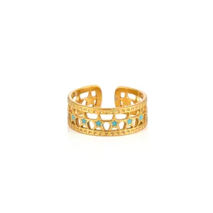 Detail of adjustable gold ring with blue enamel star cutouts and polished finish