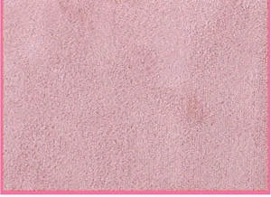 Close-up of pink faux suede fabric texture with warm soft fleece lining detail