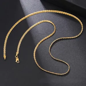 Macro detail of golden wheat chain texture with durable lobster clasp closure