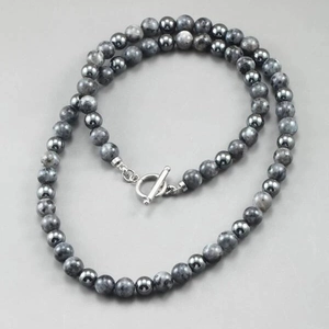 Men's beaded necklace with tiger eye and hematite stones featuring a silver toggle clasp