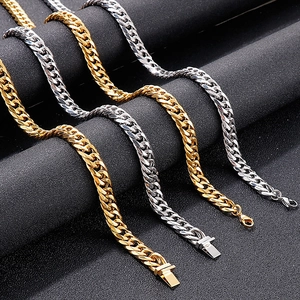 Detail of classic gold and silver Cuban curb chains showing metallic links and polished texture