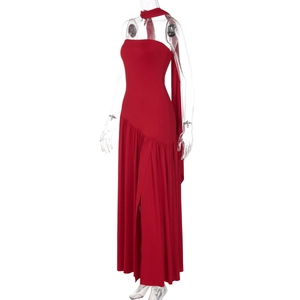 Detail view of red strapless maxi dress with side slit and elegant back ribbons