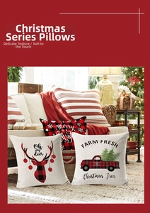Detailed view of linen Christmas pillows on a cozy sofa with warm holiday decor