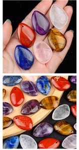 Detailed macro of teardrop natural amethyst pendants with pre-drilled holes for DIY jewelry