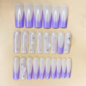 Purple French press-on nails with 3D butterflies, glitter rhinestones, and long coffin shape