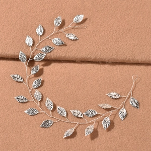 Detail view of silver metal leaf bridal headband with intricate stamped leaf textures