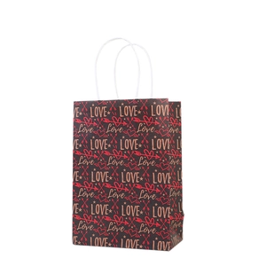Valentine's Day gift bag with red heart pattern and rope handles on black background