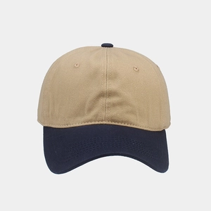 Detailed view of two-tone cotton twill baseball cap with khaki crown and navy blue brim