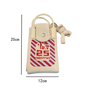 Detail showing dimensions of the beige knitted mini bag with Christmas themed patterns