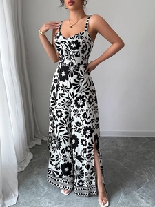 Floral print wide-leg jumpsuit with side slits and polka dot trim for elegant resort wear