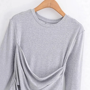 Slim fit grey long sleeve top with twist front detail and crew neck displayed on a hanger