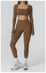Women's dark brown seamless yoga set featuring a long-sleeve crop top and high-waist leggings