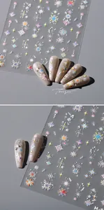 Detailed holographic snowflake and star nail art stickers with metallic silver laser finish