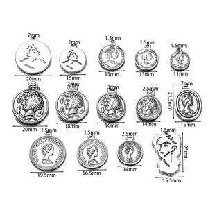 Set of vintage silver alloy coin pendants with queen portraits in various sizes
