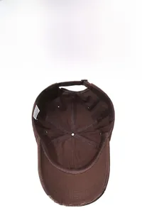 Close-up of distressed brim details on a washed cotton soft top coffee baseball cap