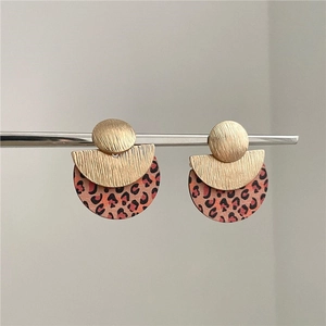 Fashionable wood leopard print earrings with gold metal disc on minimalist silver needles