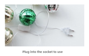 Detail of Christmas star LED light string with ribbed decorative balls and EU plug